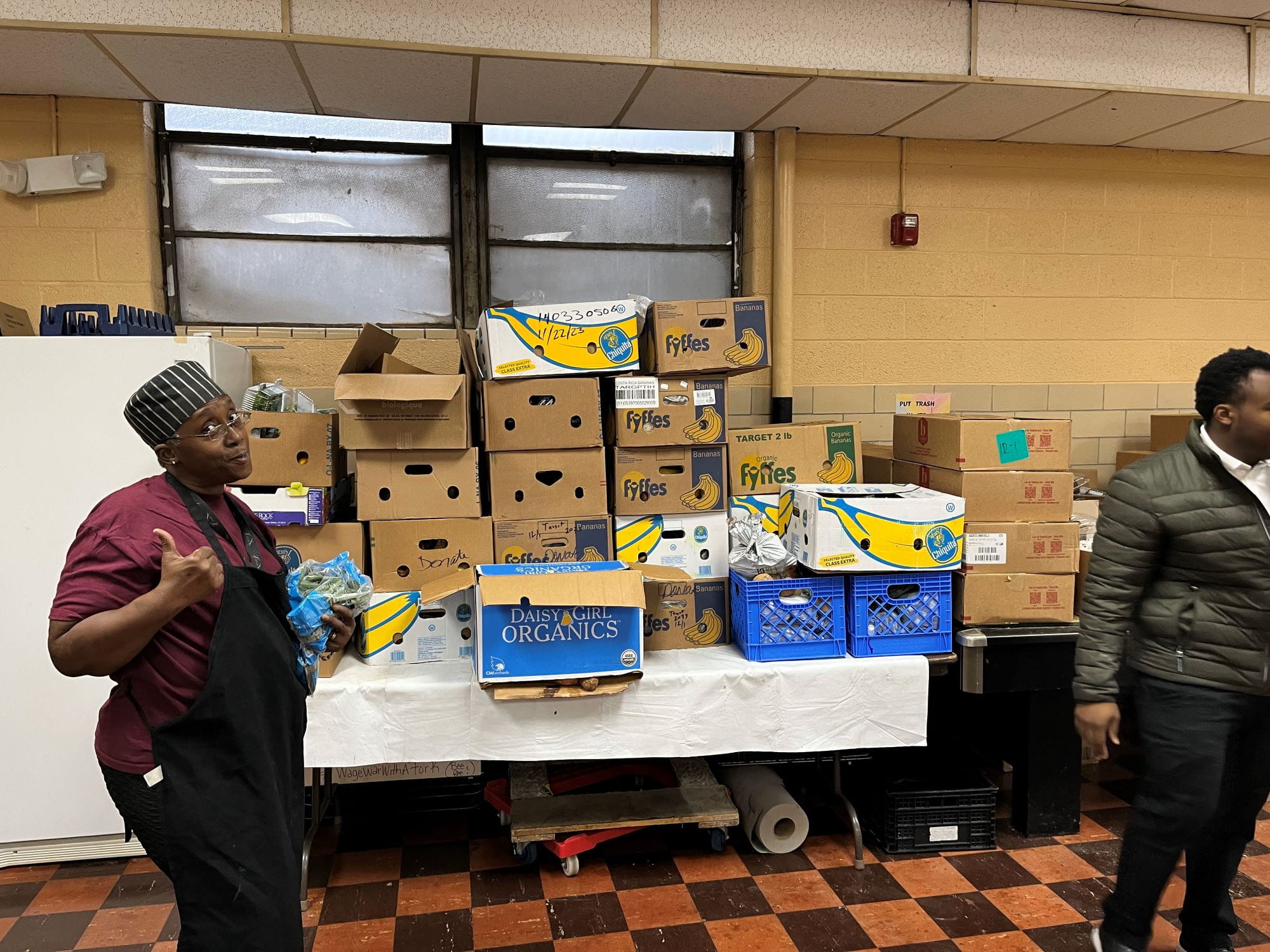 Metro Food Rescue delivers food to Harriette "Chef Bee" Brown of Sisters on a Roll Mobile Cafe and Catering.