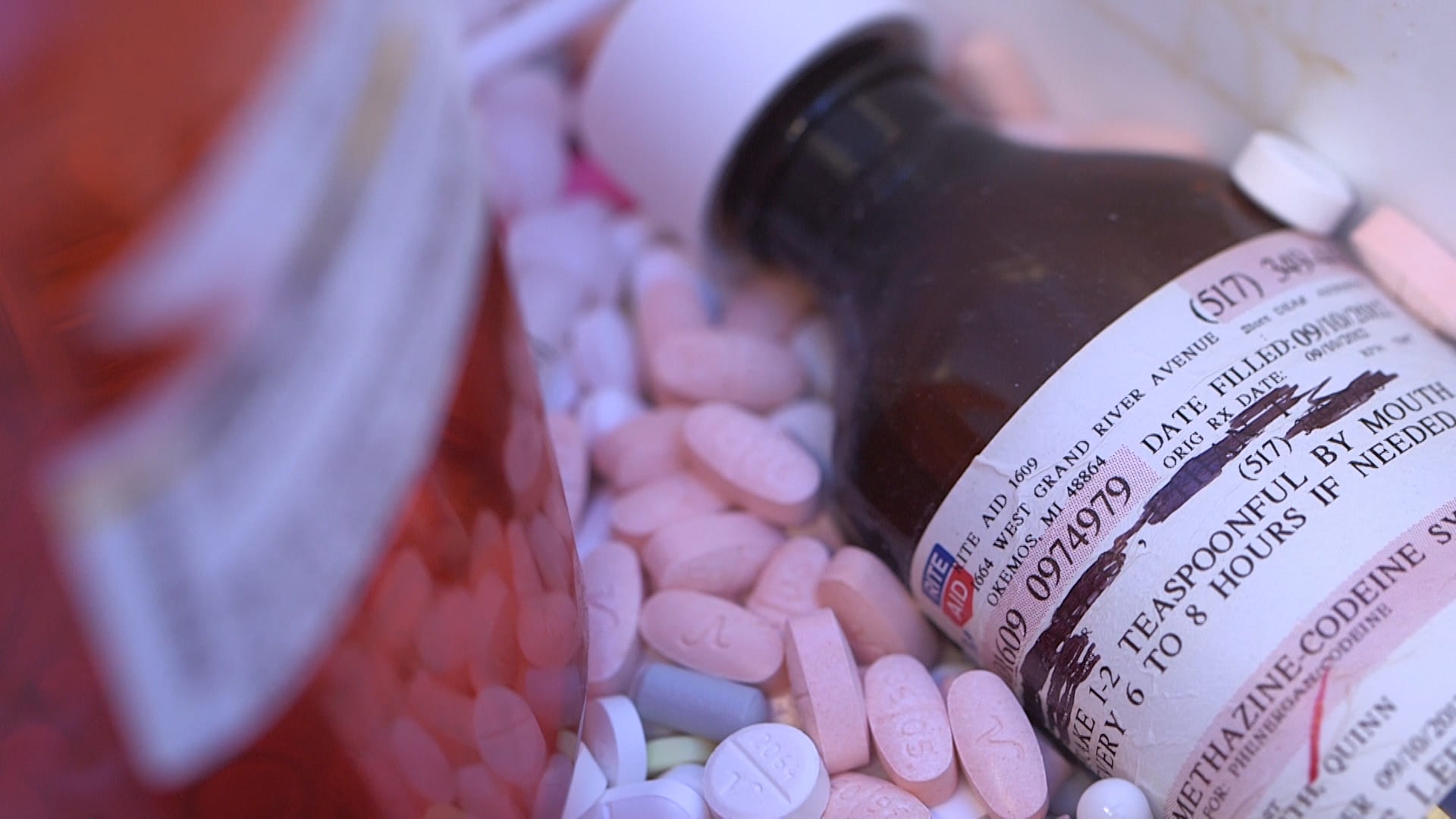 Liquid prescription and pills ready to be recycled at collection event.