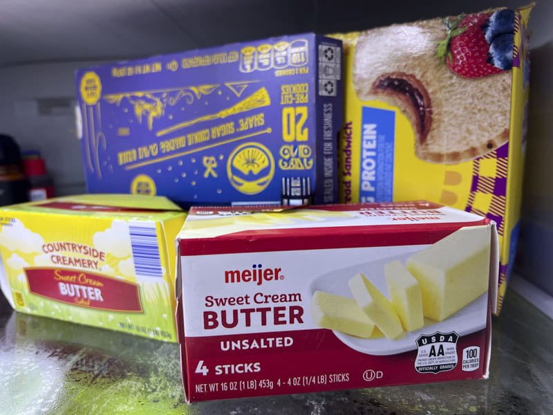 Boxes of butter, cookies, and peanut butter and jelly in the freezer