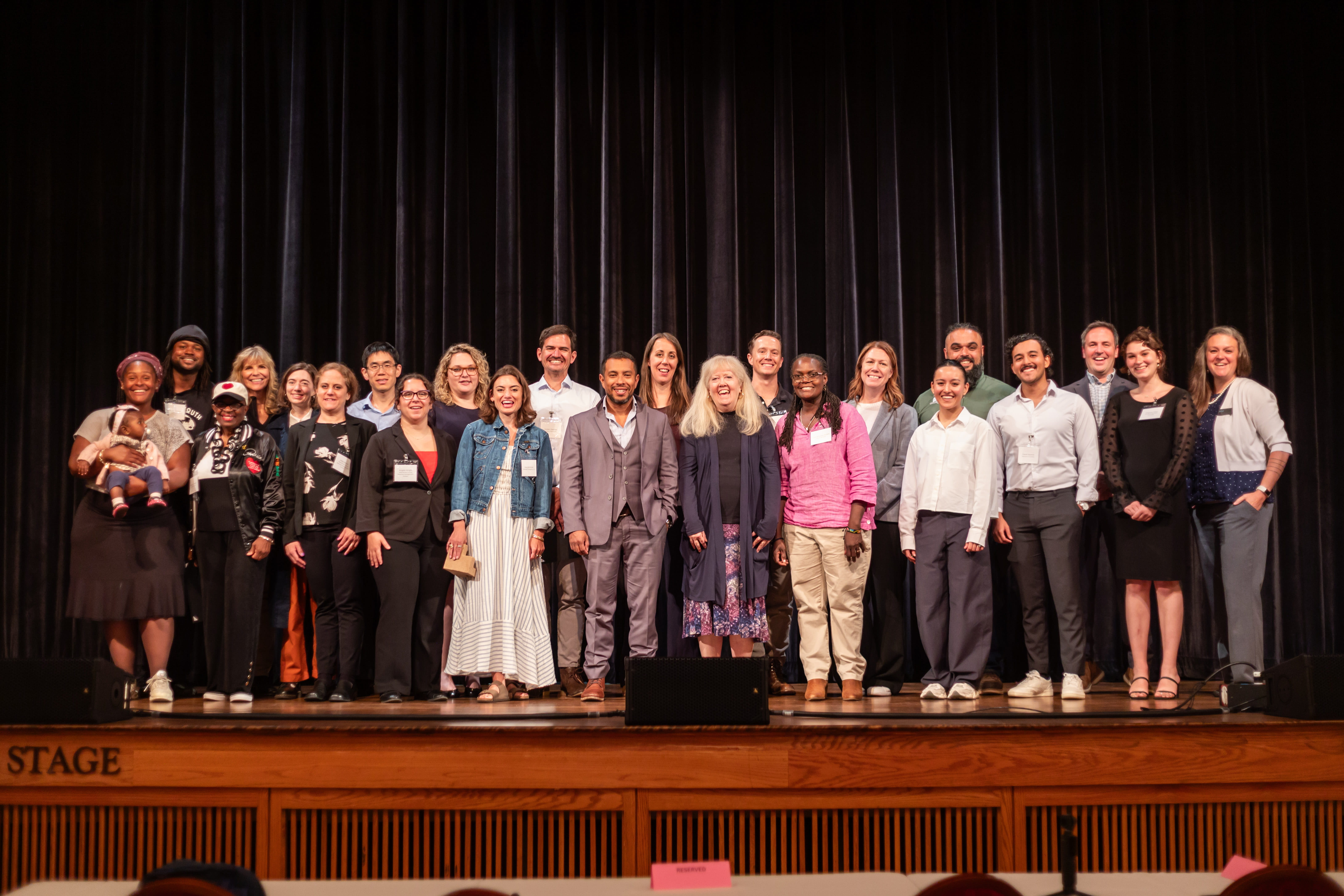 The NextCycle Michigan cohort (15 teams), with EGLE representatives at the 2026 Summer Showcase.