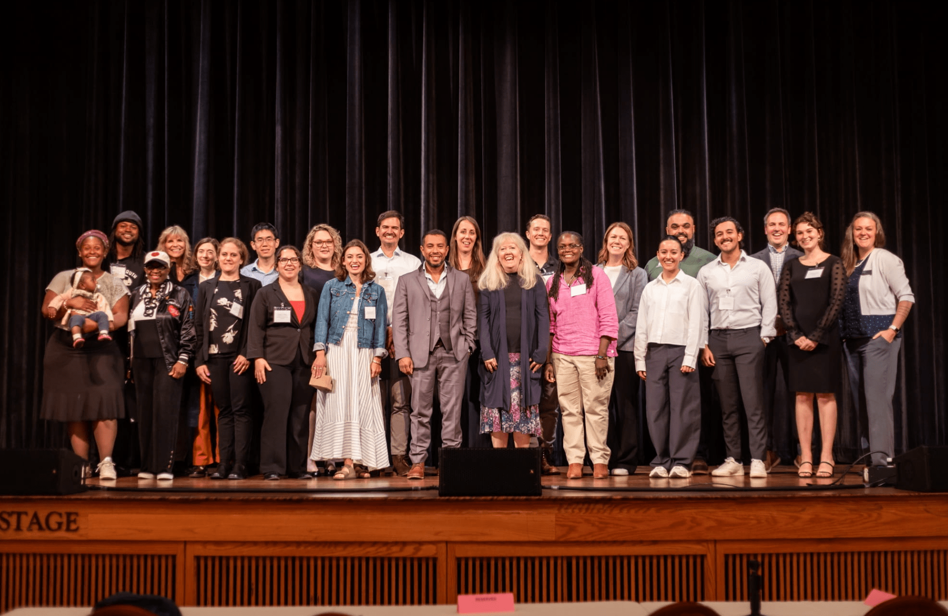The NextCycle Michigan cohort (15 teams), with EGLE representatives at the 2026 Summer Showcase.