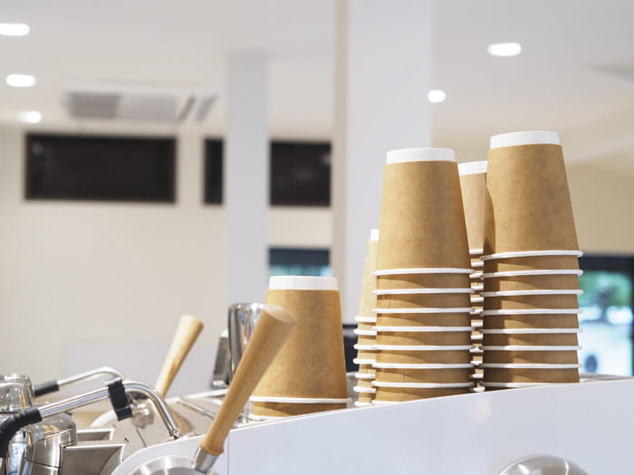 A stack of paper coffee cups