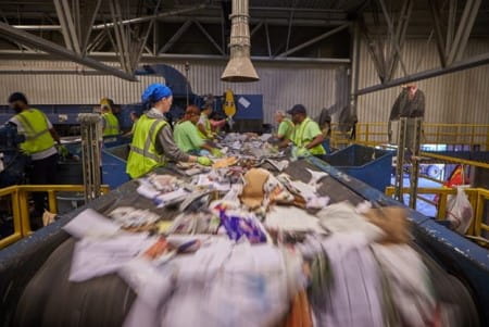 Workers sorting recycling materials