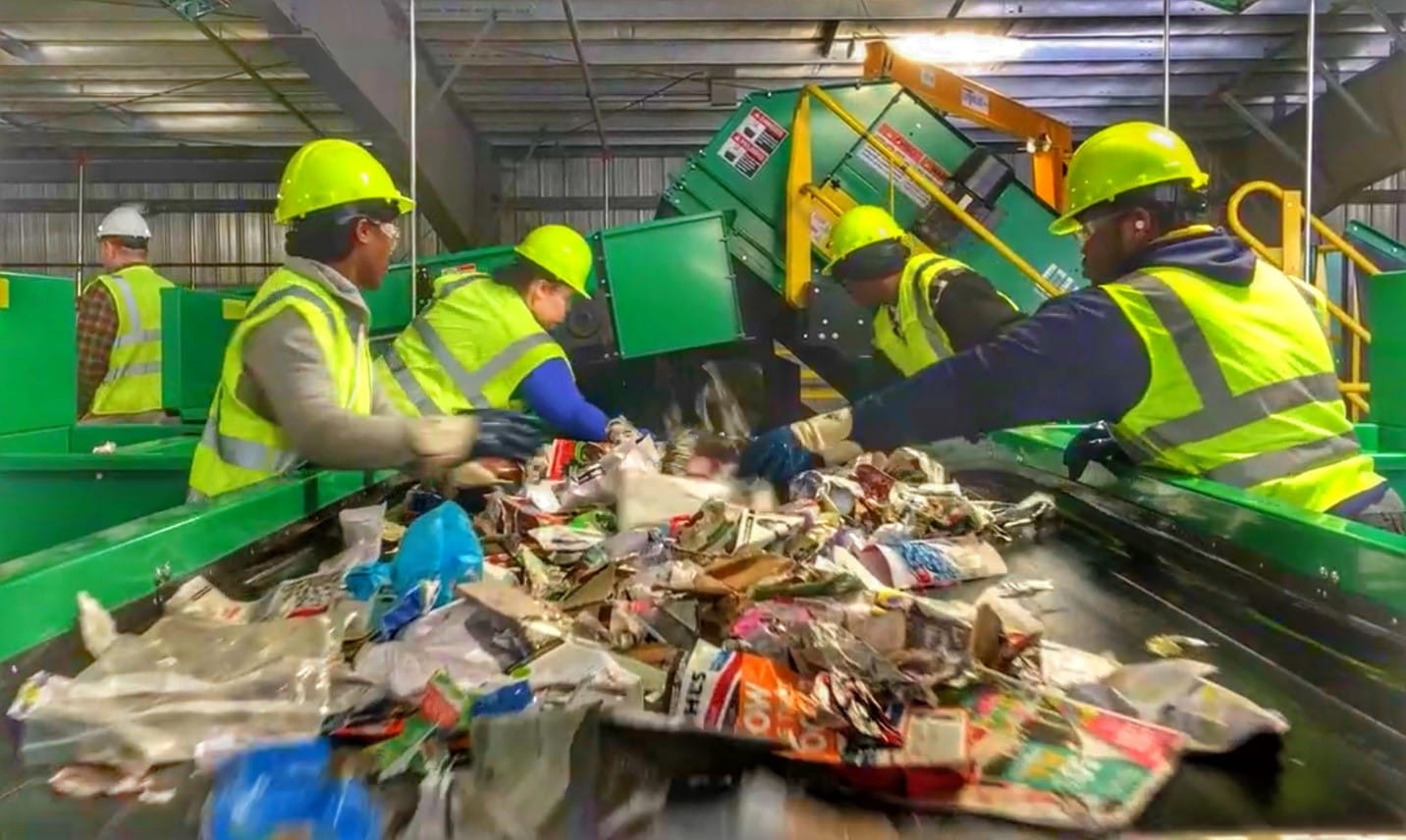 Workers sorting recycling at a Michigan facility.
