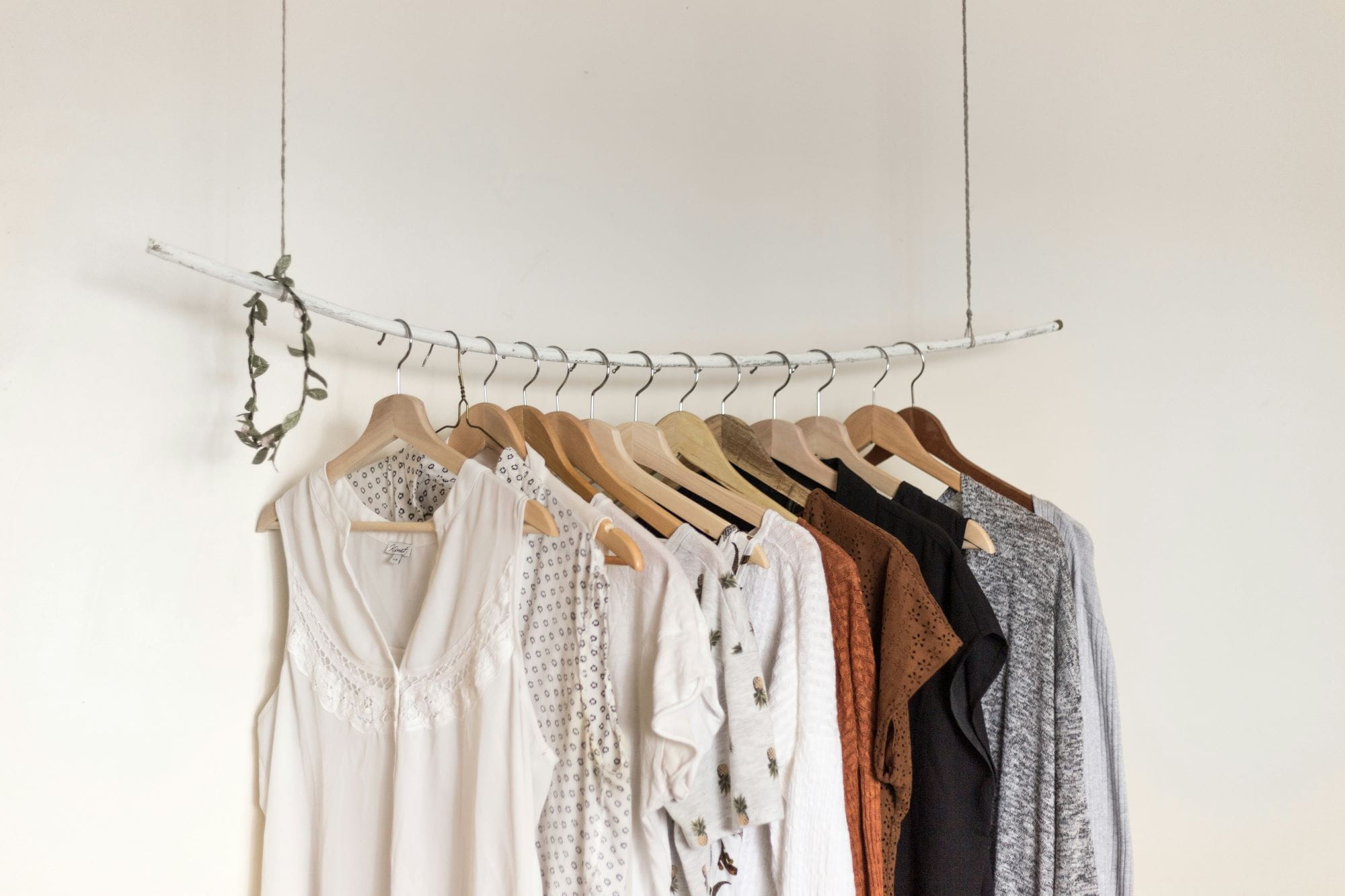 Used clothing for donation displayed on hangers.