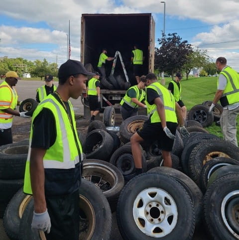 People picking up tires at Battle Creek scrap tire cleanup in 2023. 