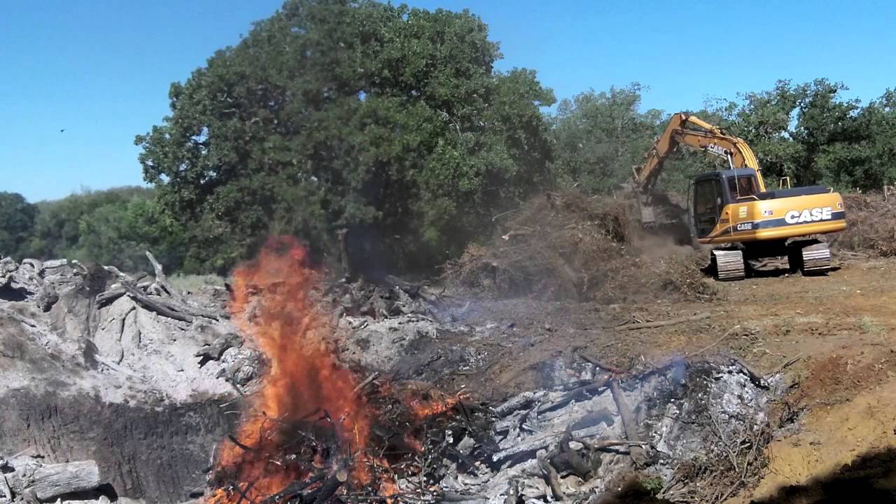 brush burning with heavy equipment