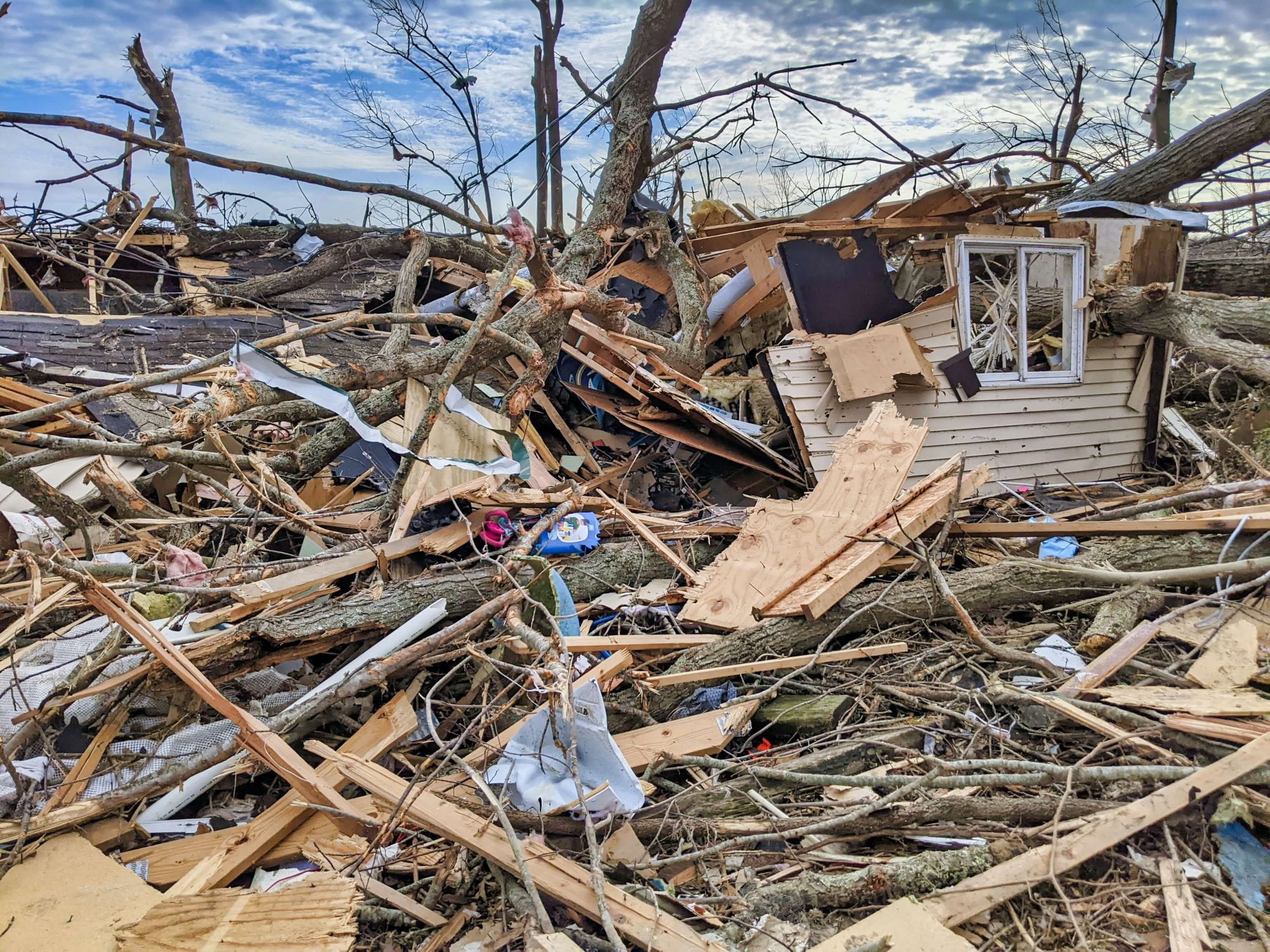 a pile of storm debris as a result from a tornado or other storm 