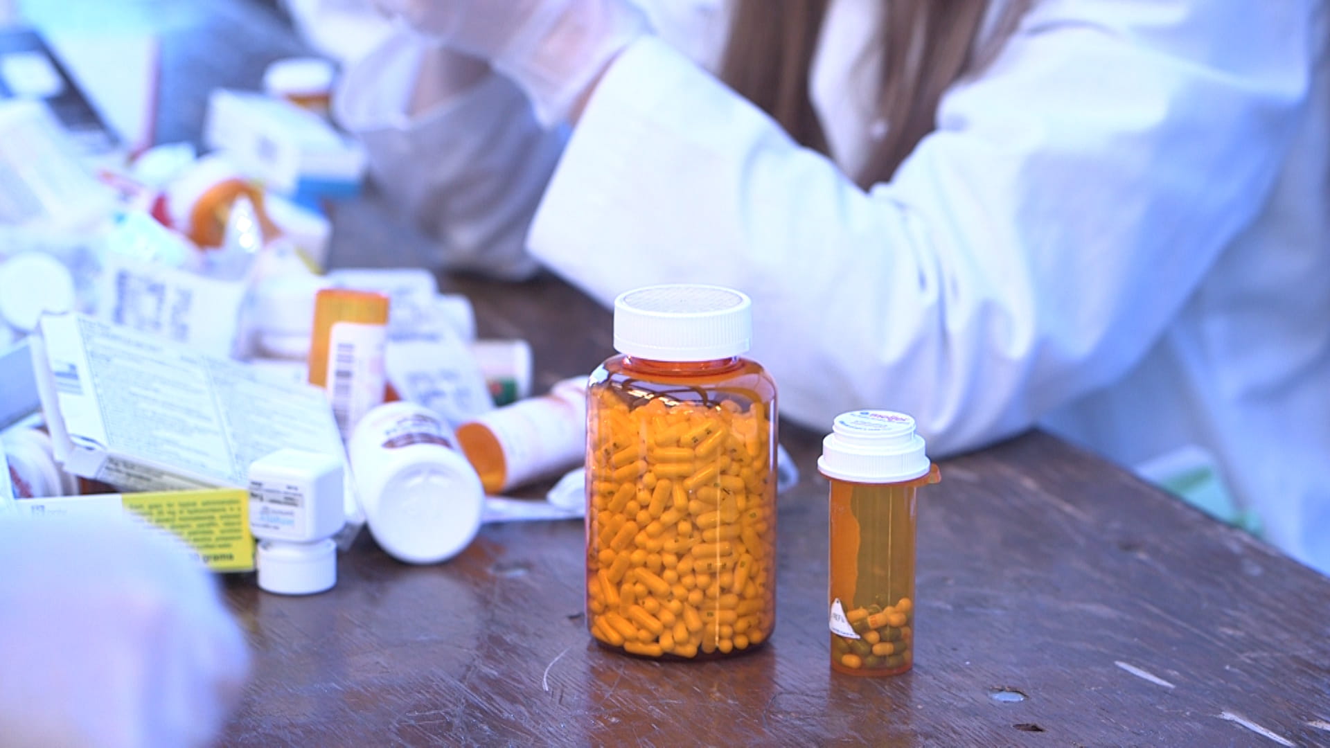 Drug disposal with people in white coats
