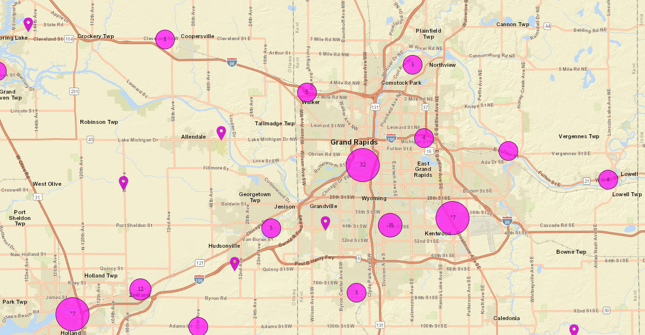 A map of Michigan, focused on Grand Rapids, with many purple dots indicating facilities