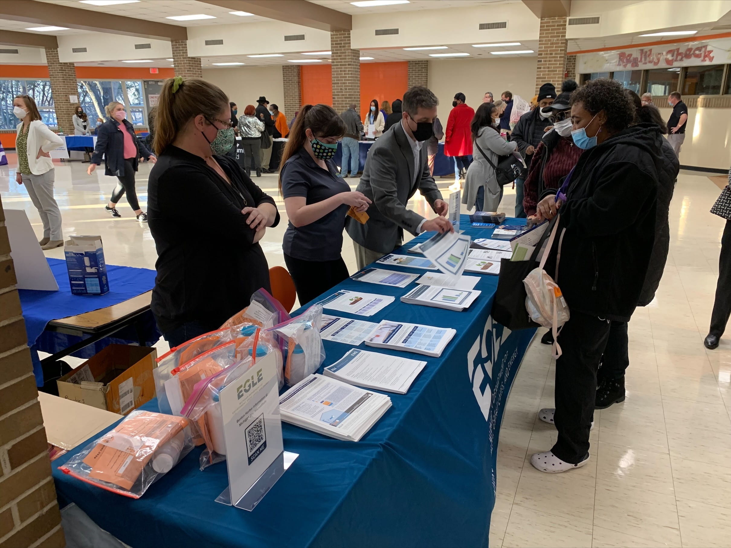 Image of staff and the public at a booth