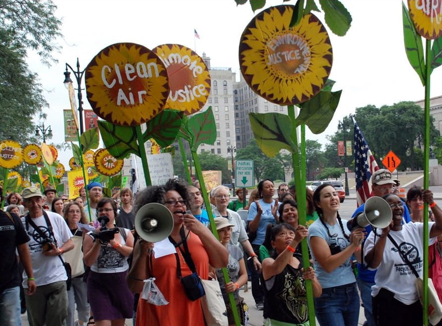 Detroit March for Justice 2015: a diverse crowd holding signs related to Environmental Justice