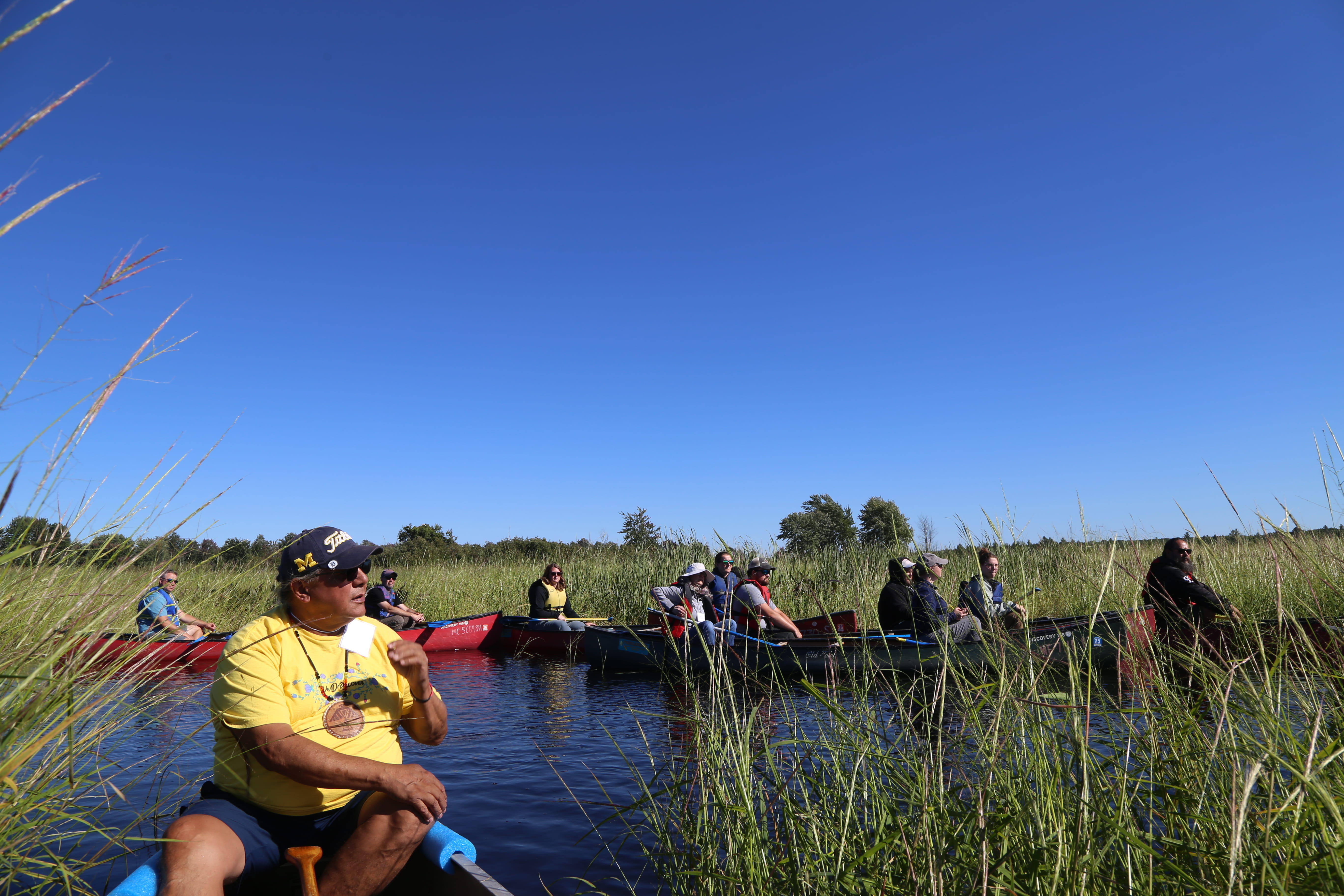 Manoomin Stewardship Plan workshop participants in kayaks exploring a manoomin bed.