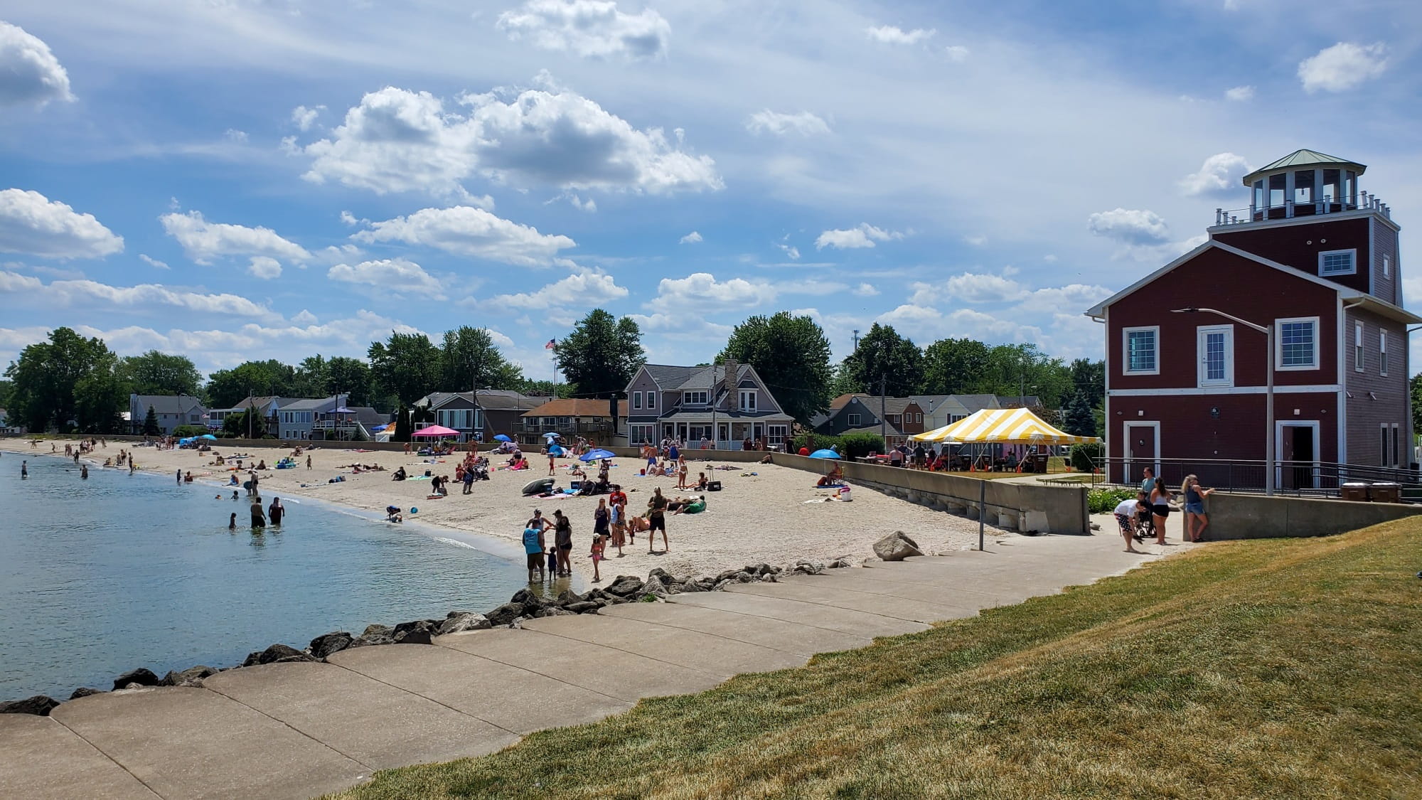 Beachgoers enjoy strolling and swimming at the shore of Lake Erie, where community efforts are focused on reducing harmful algal blooms. Photo courtesy of City of Luna Pier.