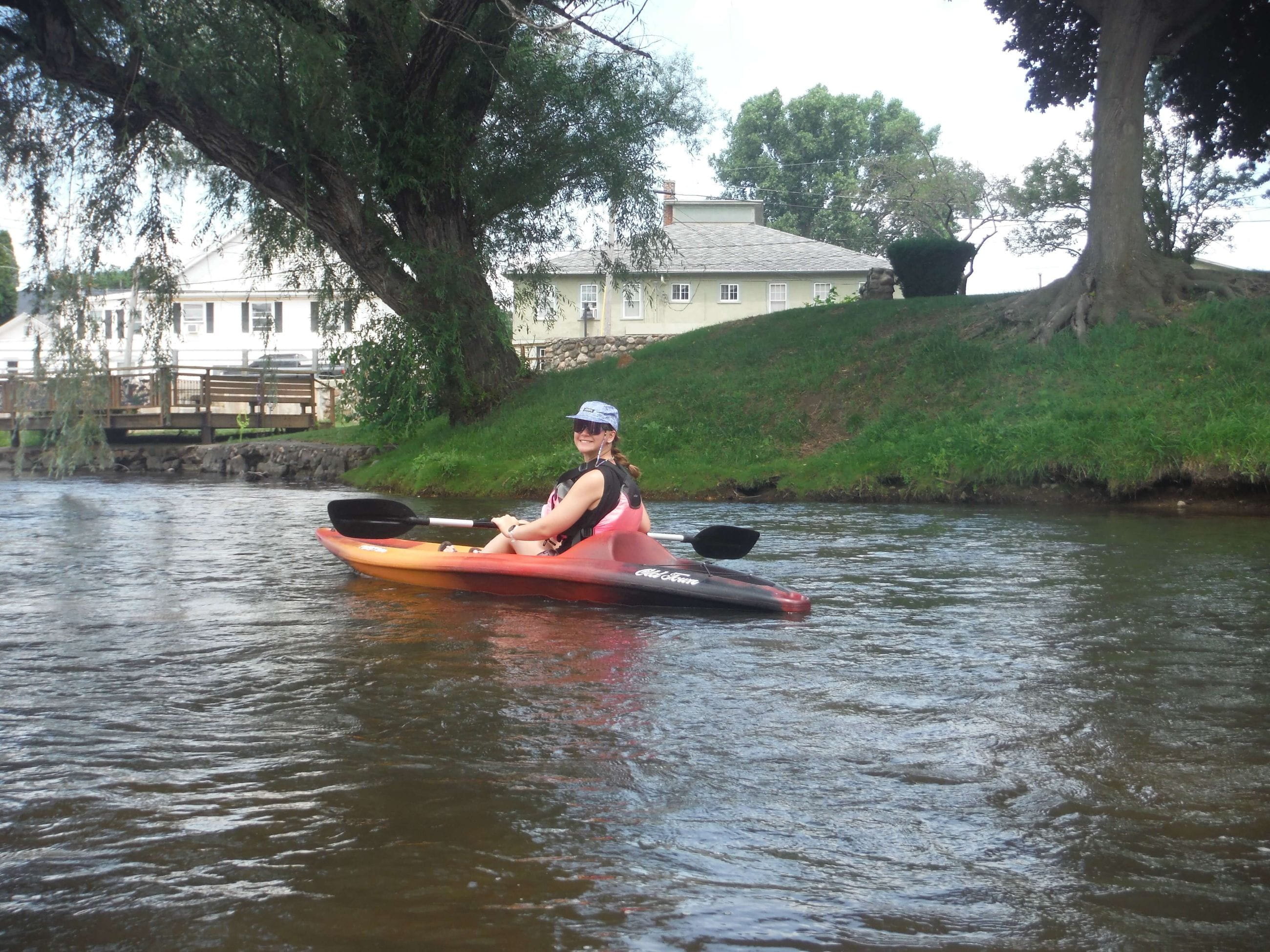 EGLE intern Maggie Styf kayaking on the Kalamazoo River. 