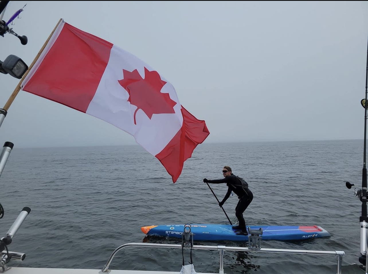 Mike Shoreman takes to the lakes on his paddle board. The Toronto native has paddled across all five Great Lakes and will join a webinar panel this week for Great Lakes and Fresh Water Week. Photo courtesy of Mike Shoreman.
