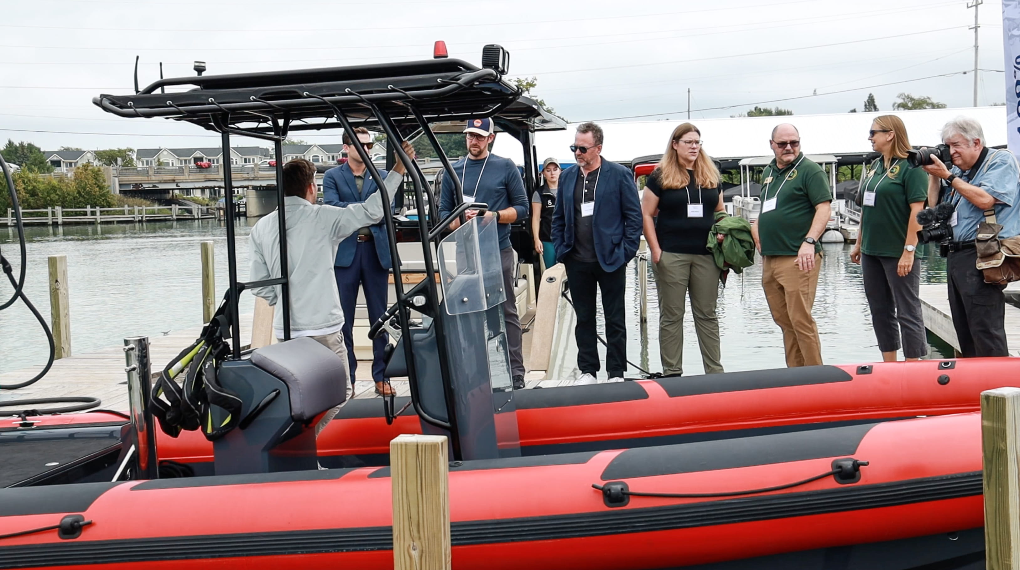 Guests check out the electric-powered Vita Seal boat at the AQUA superPower E-Marine Demo event held Aug. 24 at Elk Rapids Marina and funded through the Fresh Coast Maritime Challenge. Photo courtesy of AQUA superPower.