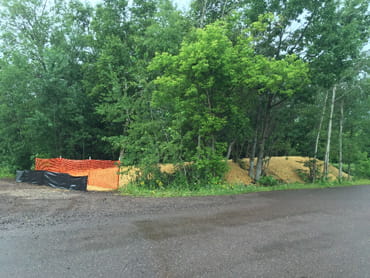 ACBM was removed and the remnants of an old dump area capped in the Ahmeek Mill Processing Area near Tamarack City Park