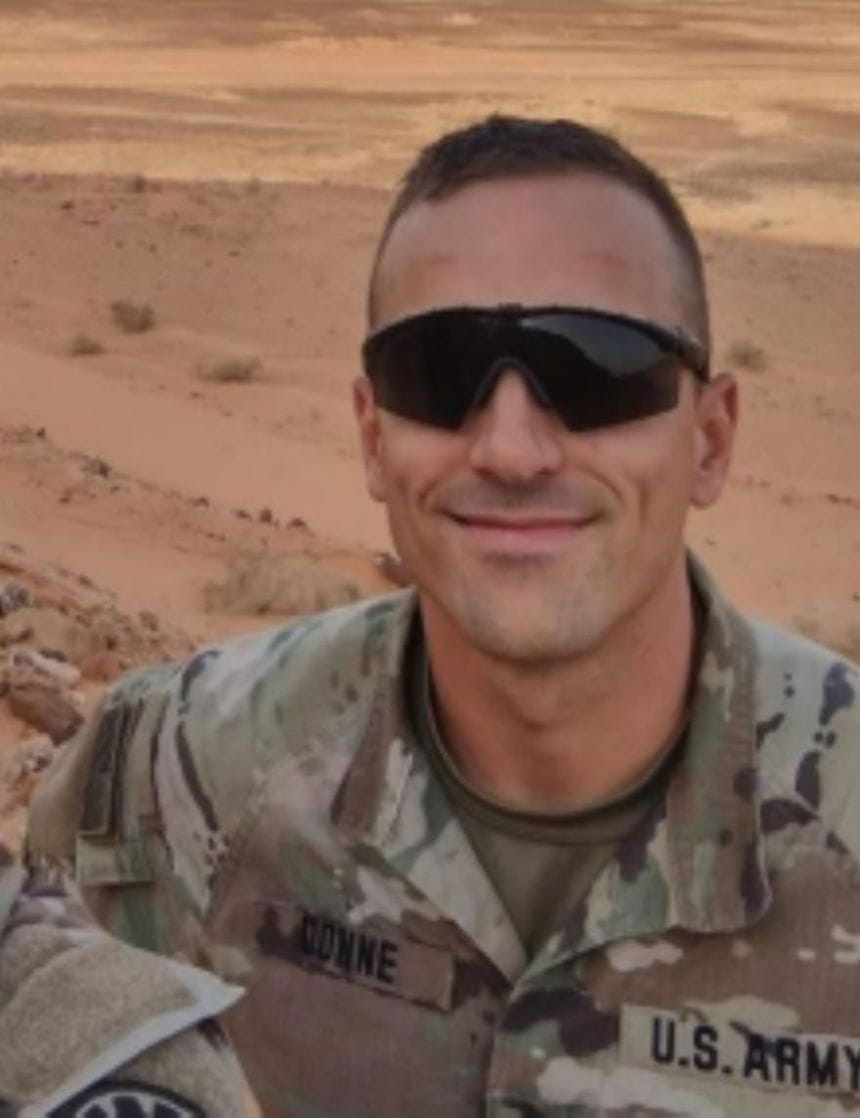 Adam Donne in uniform serving overseas. 