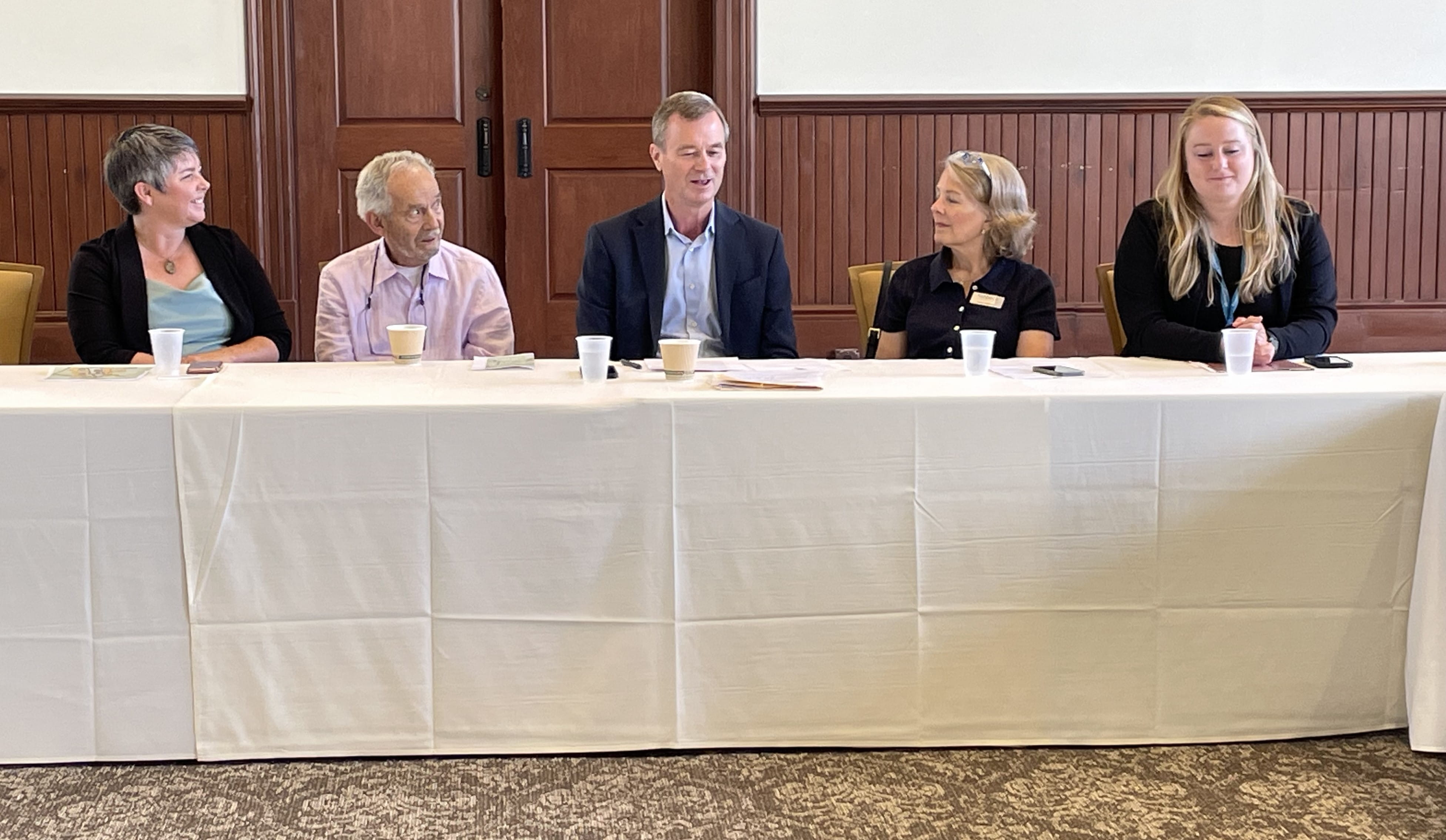 State Rep. Betsy Coffia; Raymond Minervini of Minineevini Group; Phil Roos, EGLE director; Sue Wenzlick of contractor Fishbeck,  Thompson, Carr & Huber; and Sydney Hart, EGLE's legislative liaison at the Village at Grand Traverse Commons event.