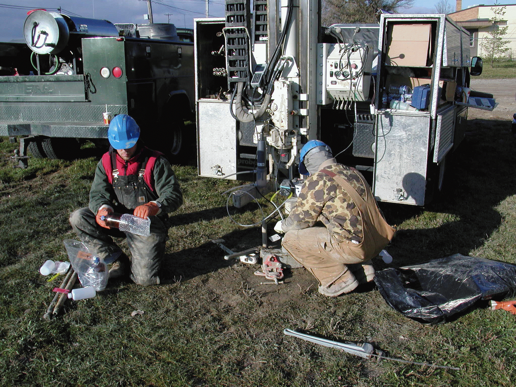 Photograph of a drill crew using a Geoprobe in the field