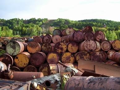 Photo of stockpiled drums historically present in the QMCP area.