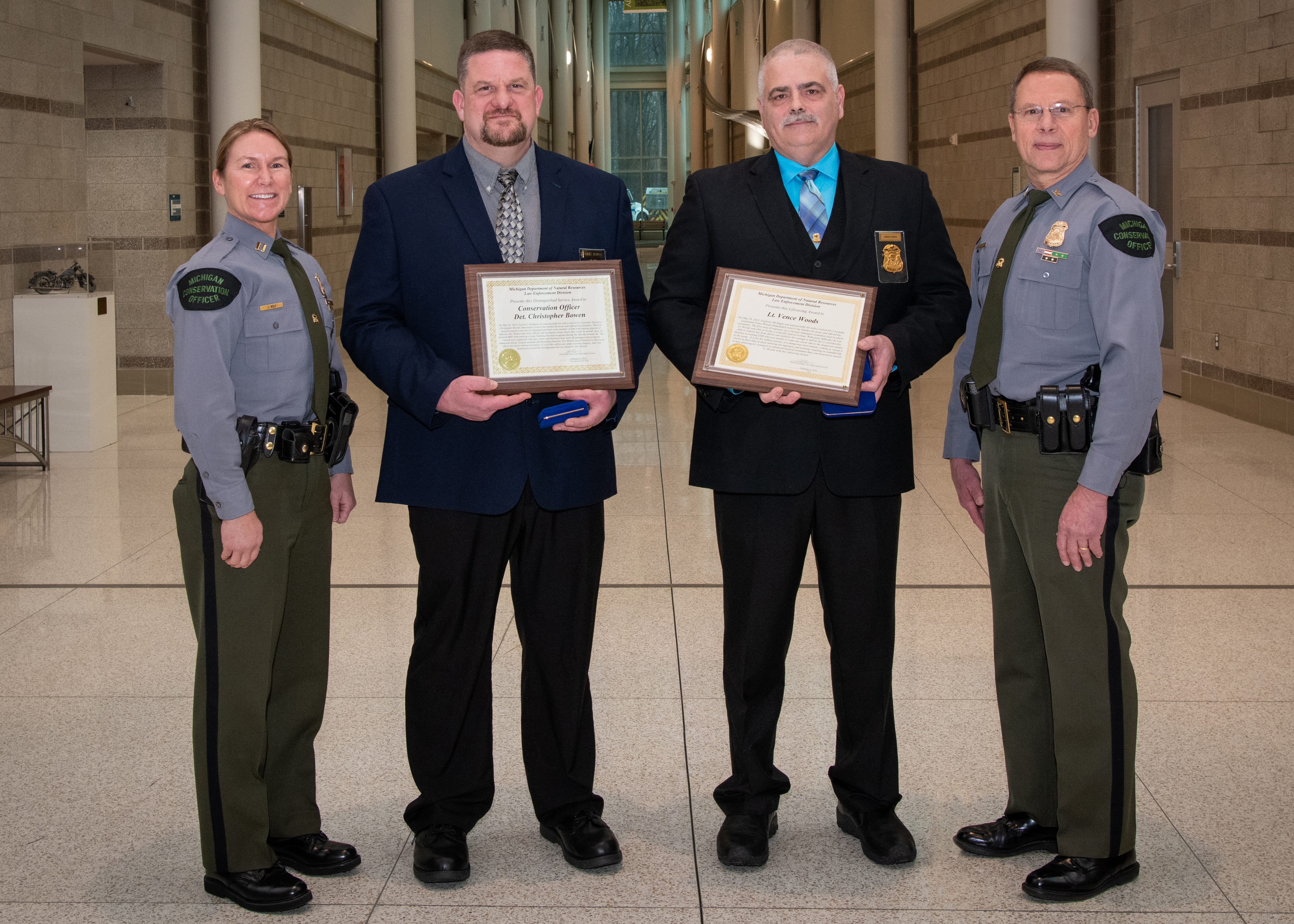 Chris Bowen and Vence Woods receive DNR Law Enforcement Division awards.