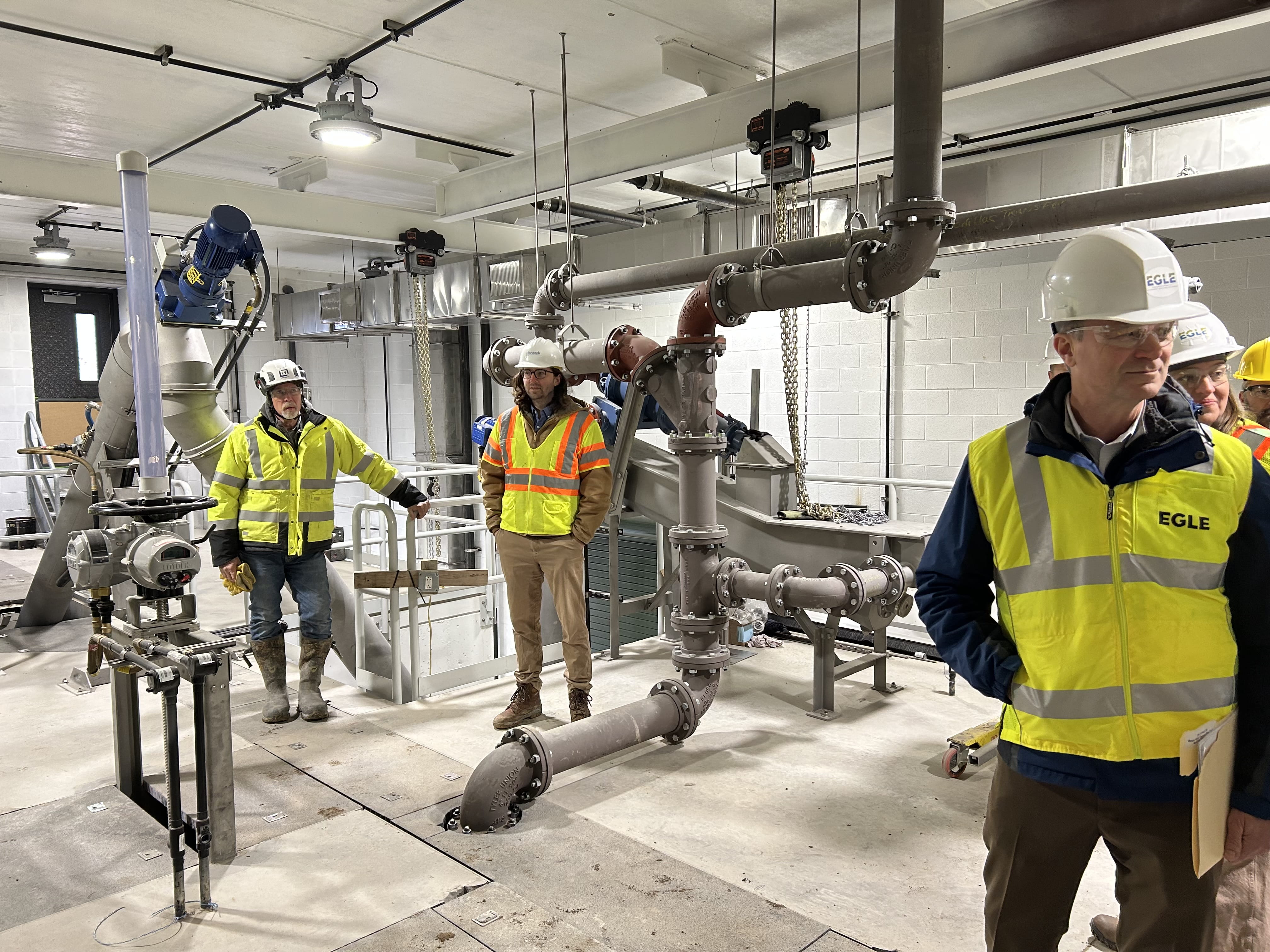 EGLE Director Phil Roos (right) tours water infrastructure in Reed City