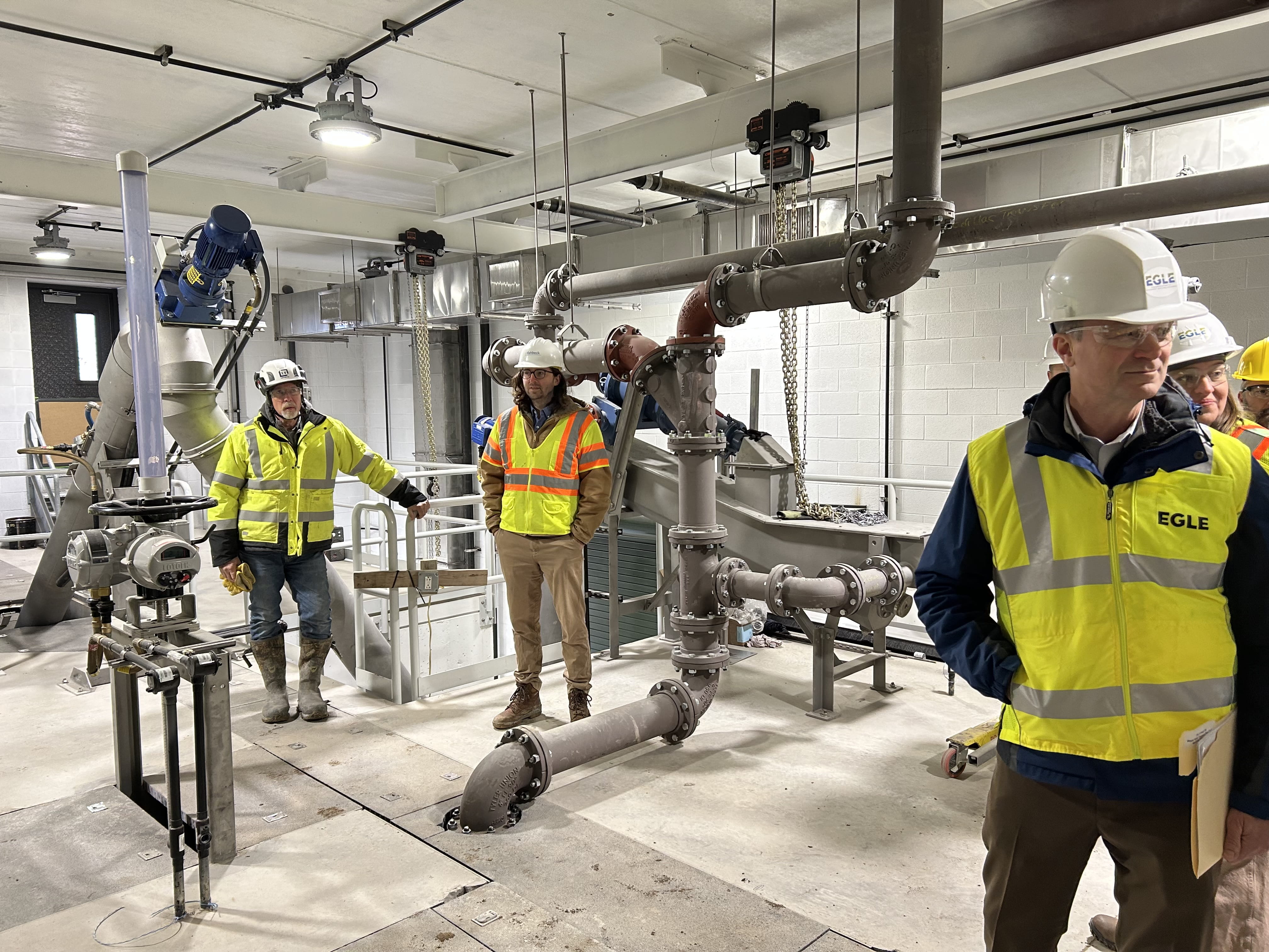 EGLE Director Phil Roos (right) tours water infrastructure in Reed City