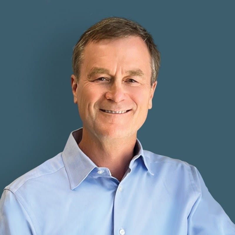 EGLE Director Phillip Roos in a blue button up, smiling at the camera