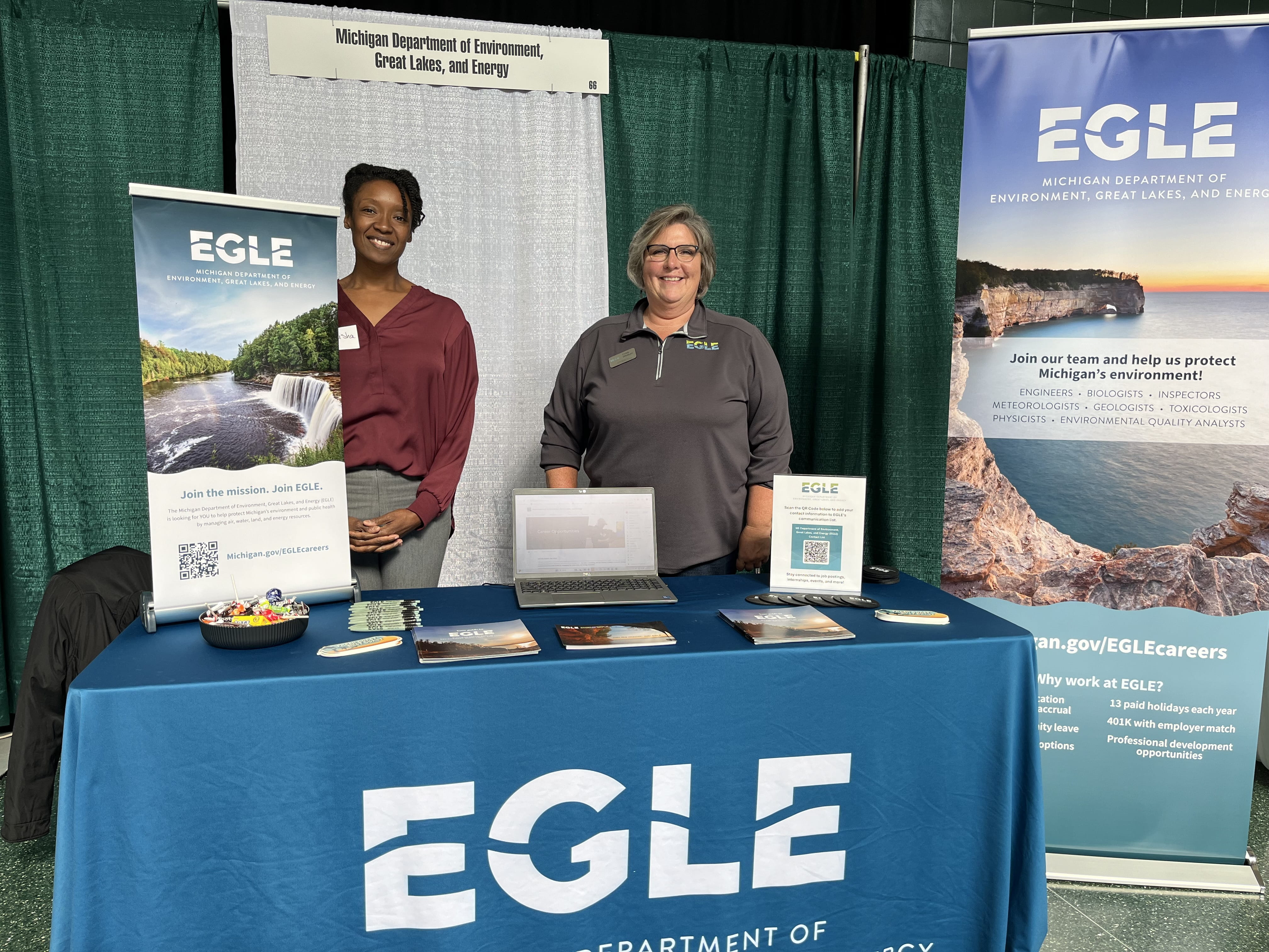 Cindy Whittum, EGLE’s recruitment and internship specialist (right), and Keisha Williams, toxicologist at EGLE’s Air Quality Division, at a career fair at Michigan State University in October 2024.