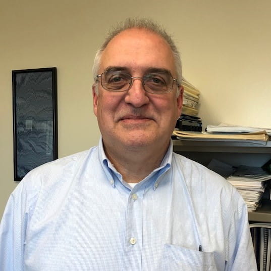 Phil Argiroff, smiling against an office backdrop