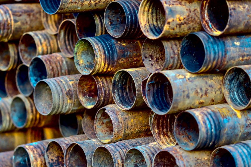 A stack of corroded plumbing pipes