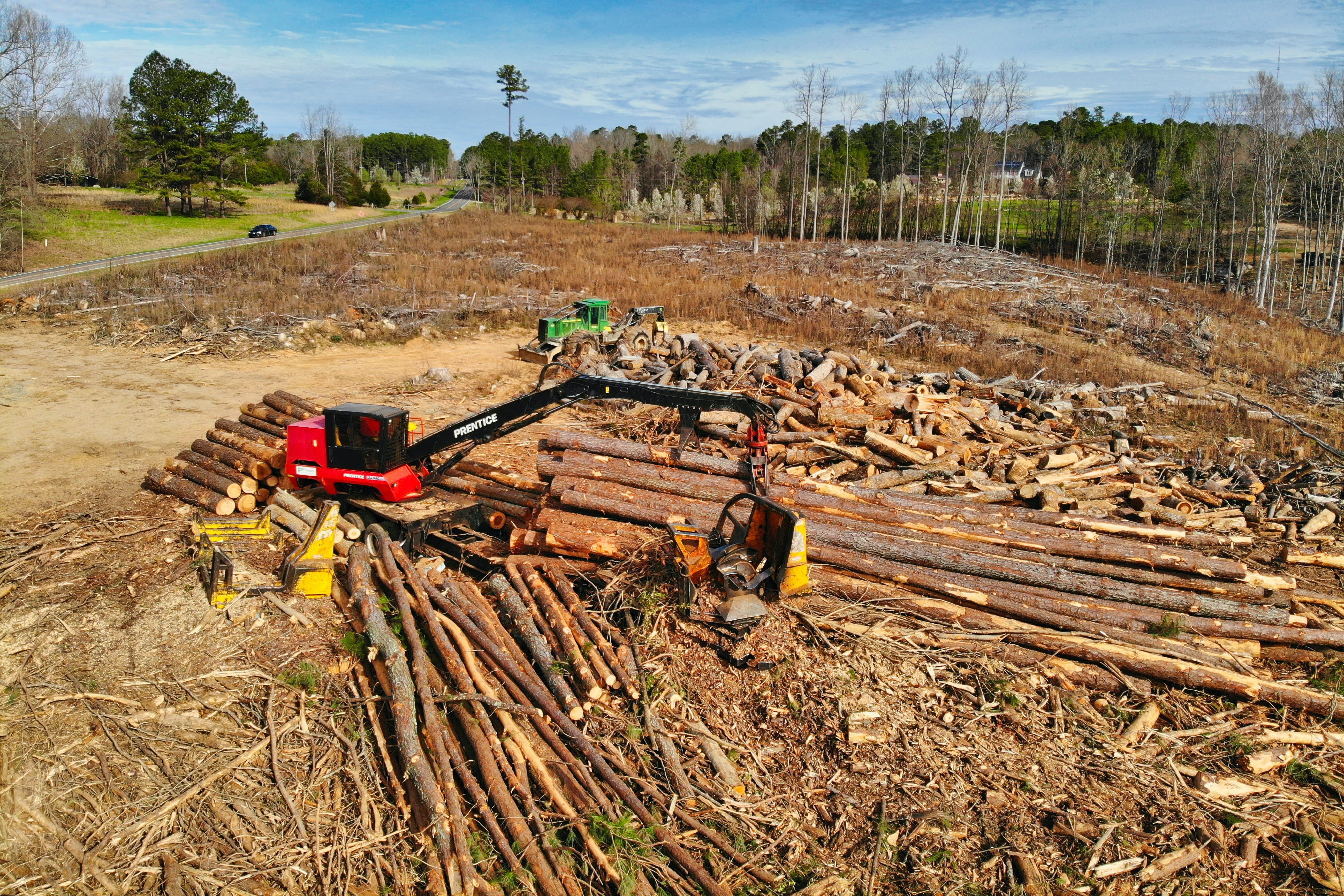 An aerial view of logging machinery working on clearing land