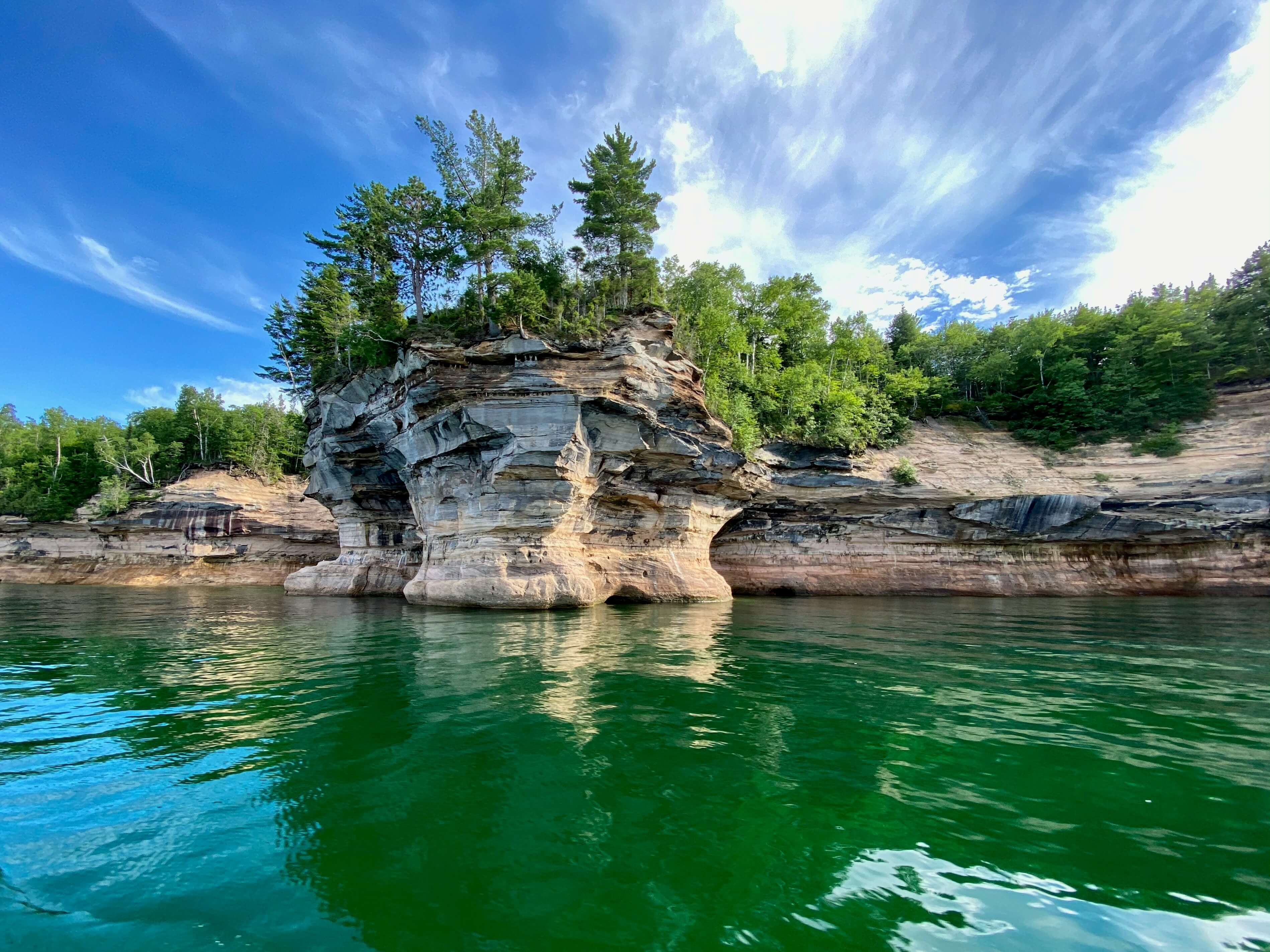 Scenic view from the water of a rock formation on the Pictured Rocks National Lakeshore in Munising Michigan