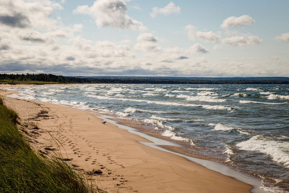 choppy waves on the sandy shores of lake superior