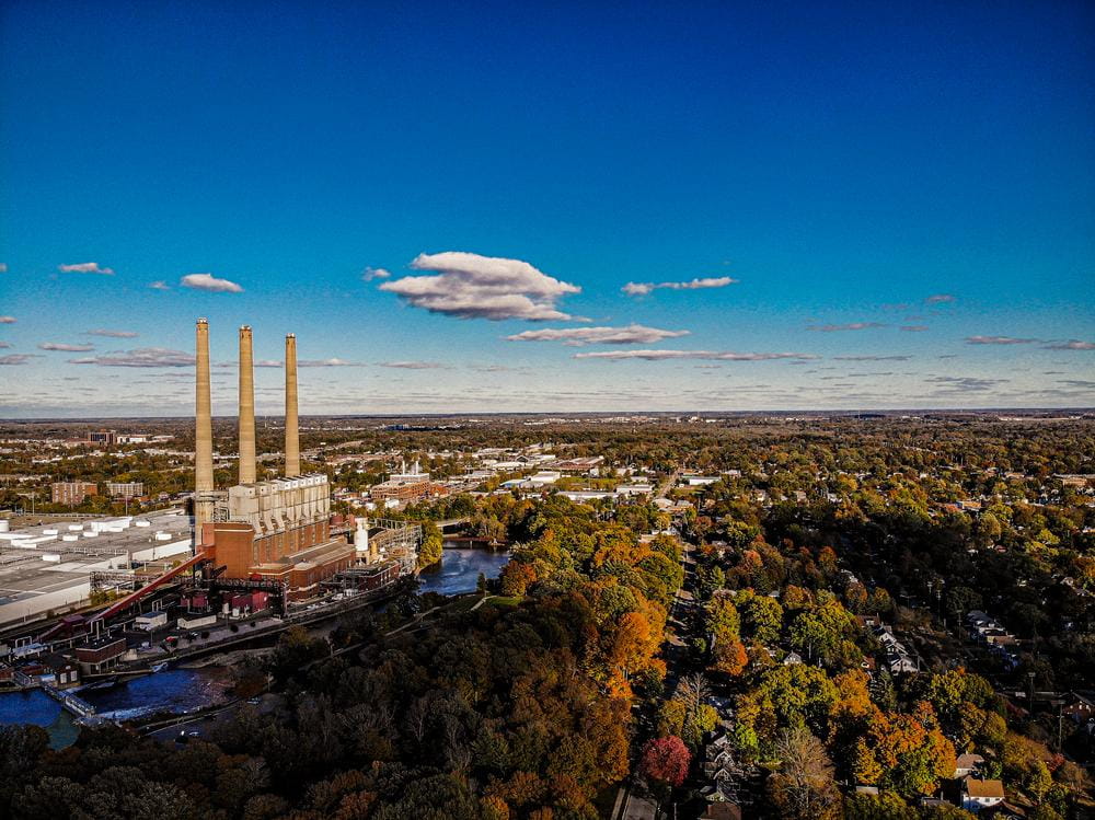 An aerial view of the Lansing Eckert Coal Plant on the Red Cedar River in Moores Park neighborhood during the Fall.