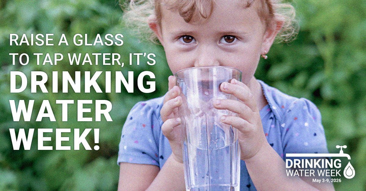 Child drinking a glass of water with text: Raise a glass to tap water, it’s drinking water week May 3-9, 2026!