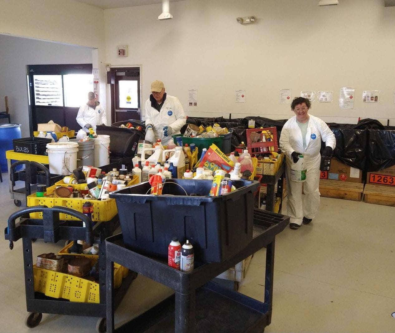 Staff at the Kalamazoo County Household Hazardous Waste Center process a large drop-off of waste. Courtesy: Cindy Foster.