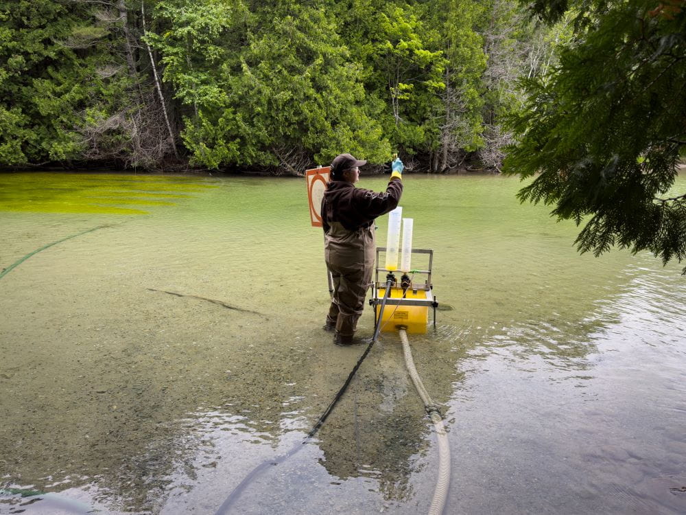 Sea lamprey control treatment crews apply lampricides to kill larval sea lamprey. Courtesy of GLFC.