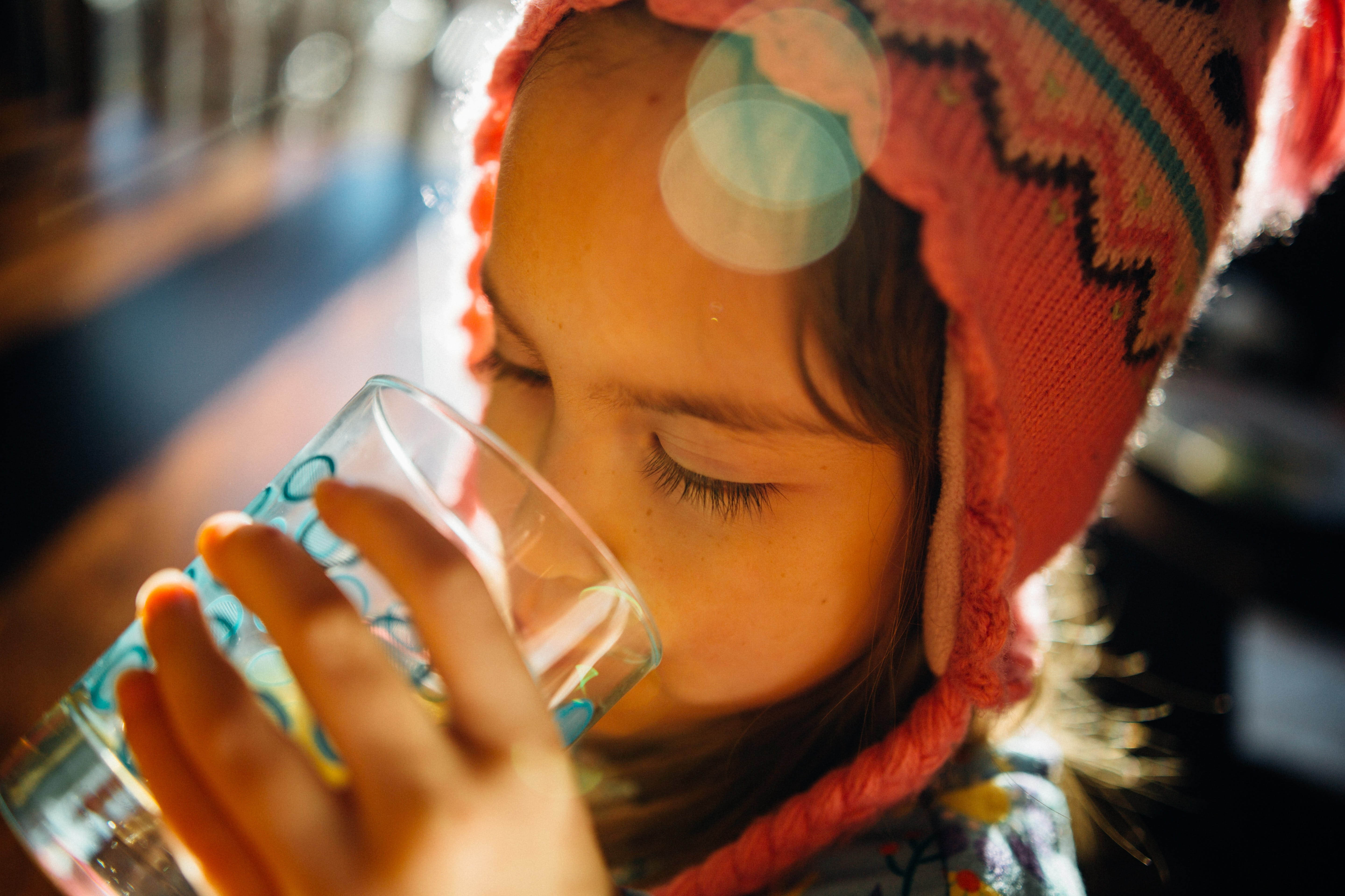Girl drinking water from a glass
