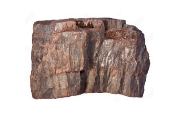 A squarish red-brown rock