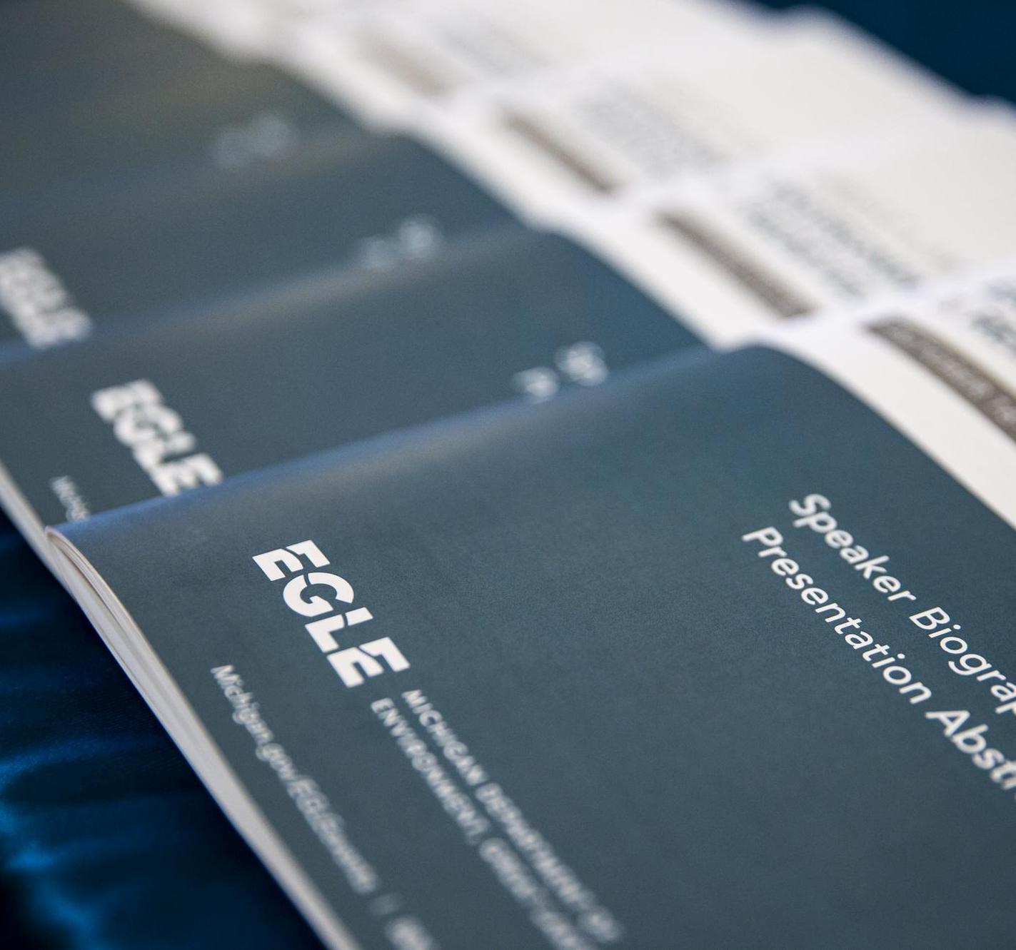 Booklets fanned out on table