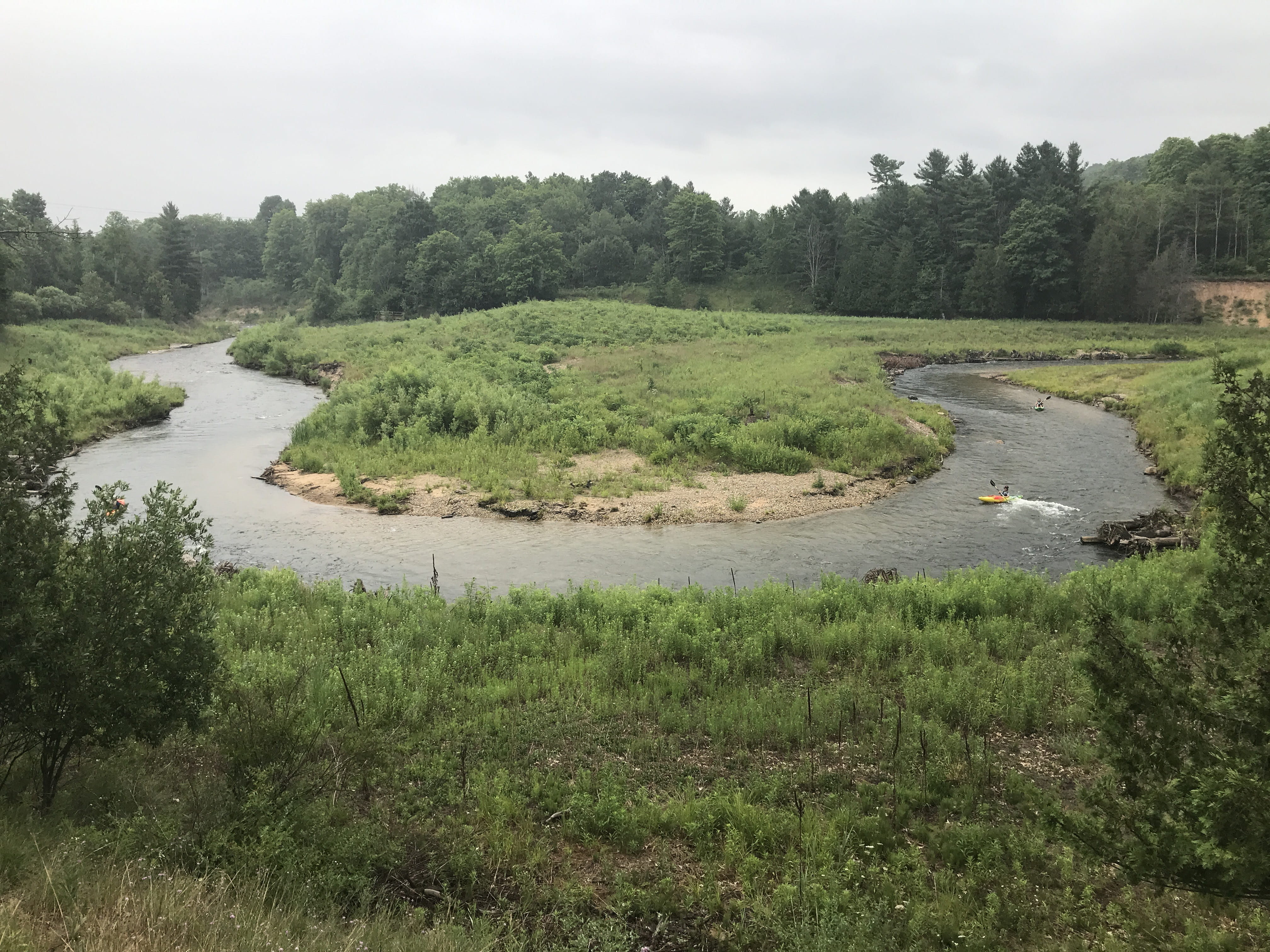 Kayakers paddling down the Boardman River