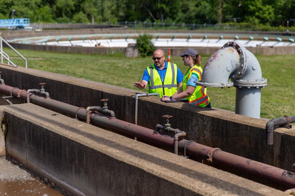 Two staff overlooking part of the Kalamazoo Wastewater Treatment Plant