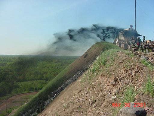 Biosolids spray application on mine spoil pile