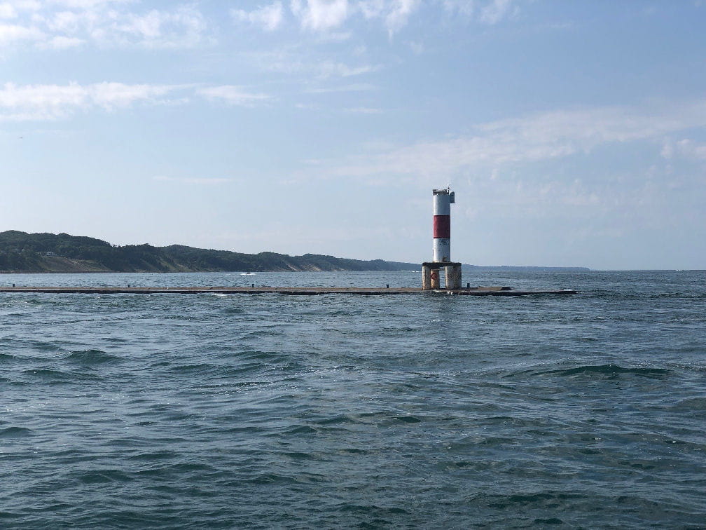 High water on a Michigan great lake, pier at Holland MI nearly submerged