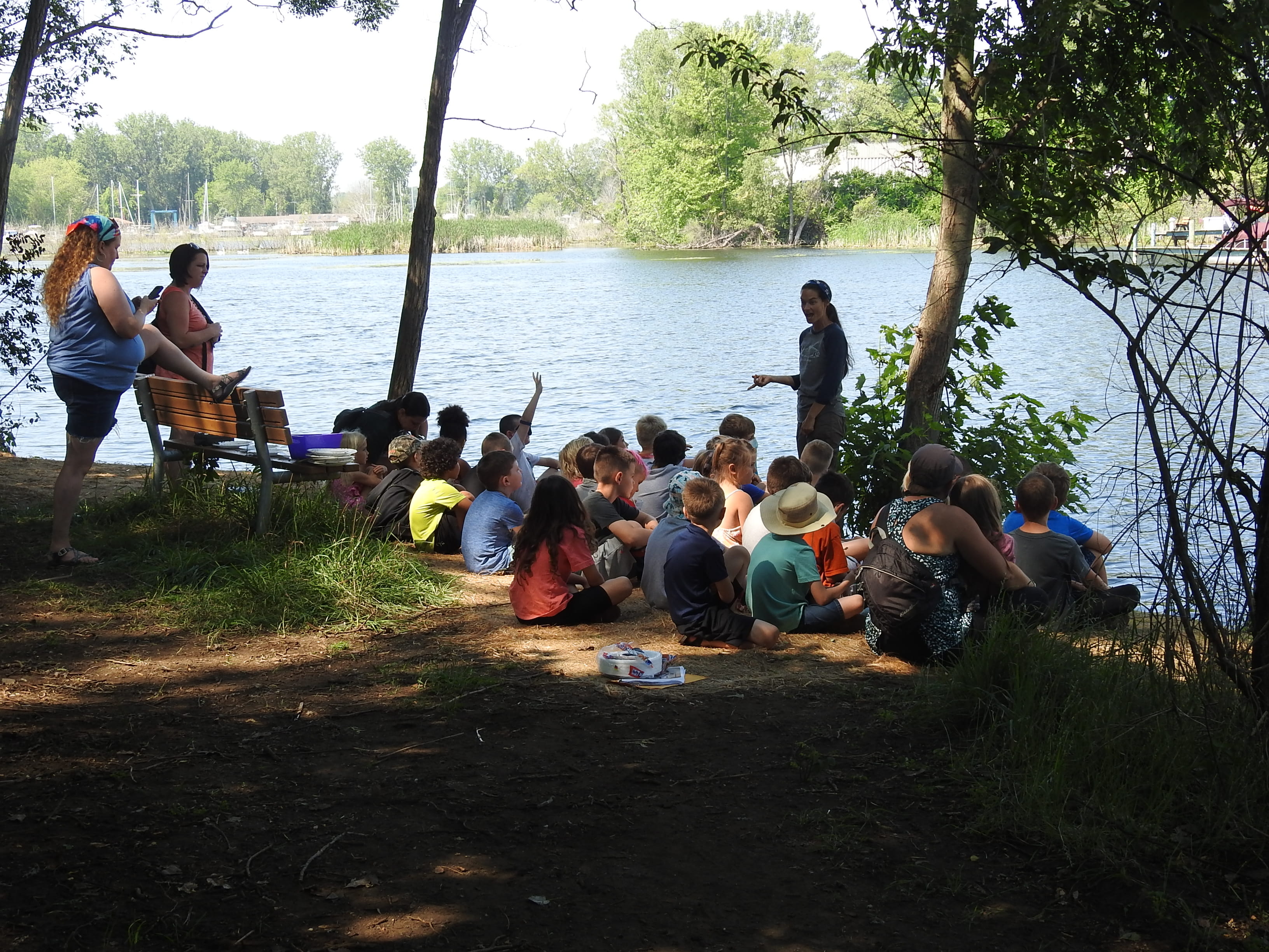 Children get a taste of the outdoors at the Muskegon Lake Nature Preserve as progress continues on restoration of the Muskegon Lake Area of Concern. Photo courtesy of West Michigan Shoreline Regional Development Commission.
