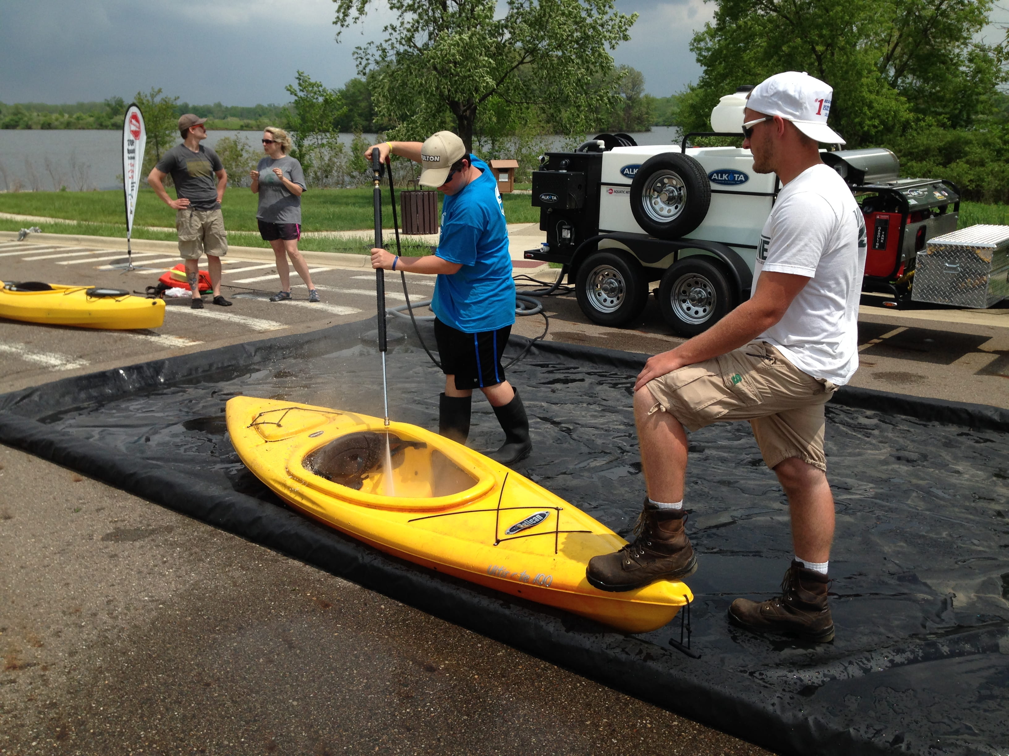 Kayak washing at Clean Drain Dry event.