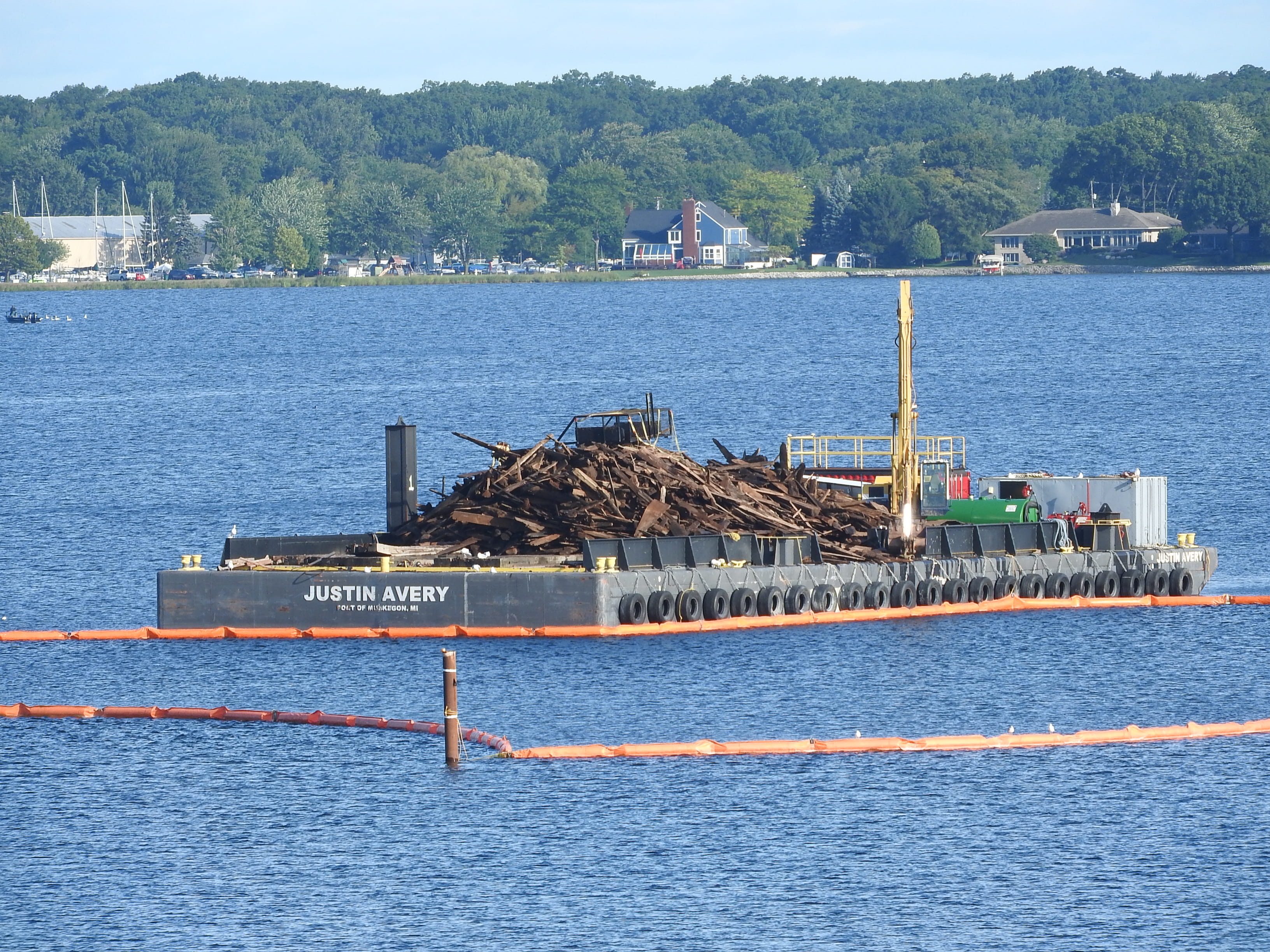 A load of mill debris on a barge from Muskegon Lake. 